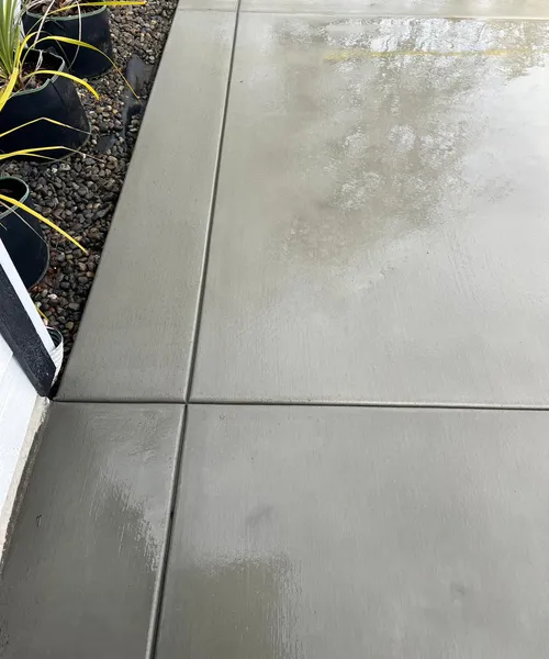 Broom Finish Driveway Replacement With Decorative Borders in Newcastle 